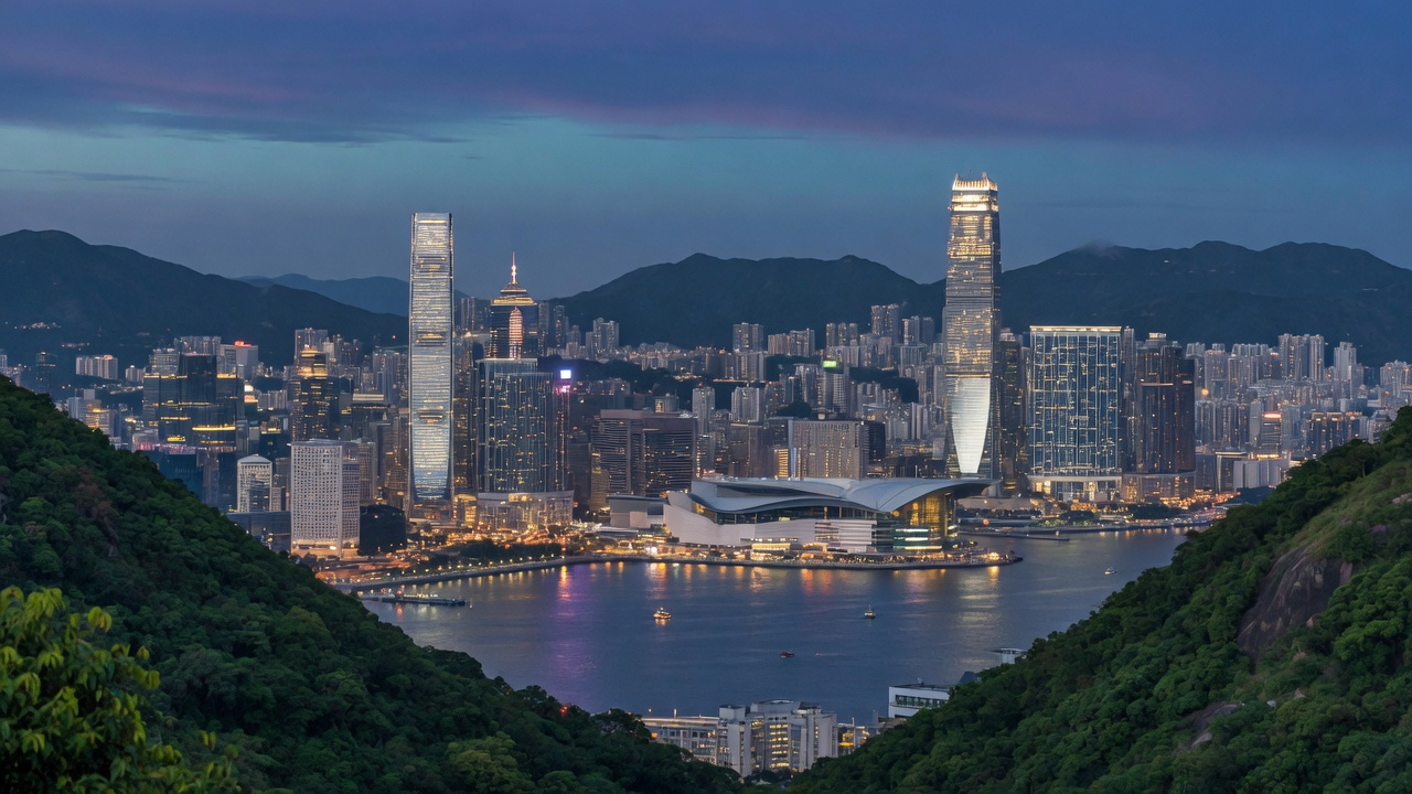 Victoria Harbour and the Hong Kong Island skyline seen from Victoria Peak at blue hour